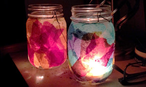 Finished tissue paper lantern illuminated with candle