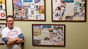 Tal in front of the History of Badger wall
