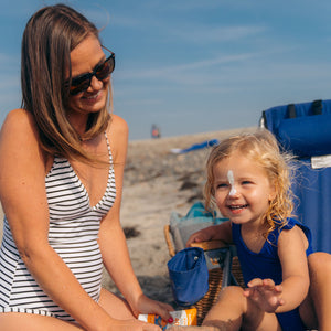 kids mineral sunscreen cream family on beach